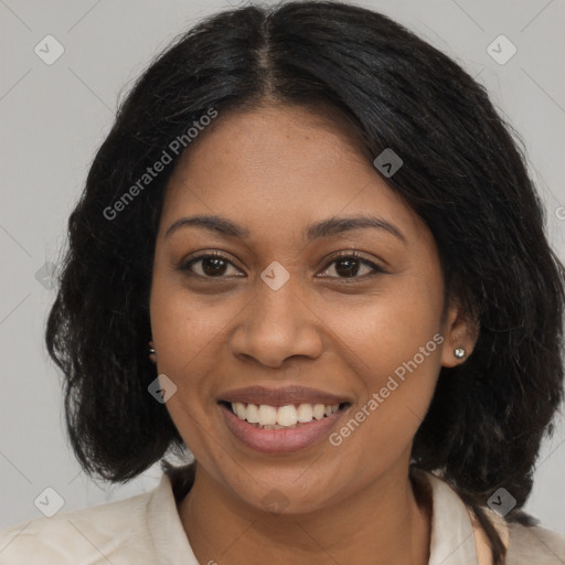 Joyful black young-adult female with long  brown hair and brown eyes