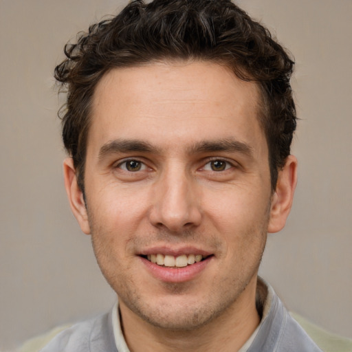 Joyful white young-adult male with short  brown hair and brown eyes