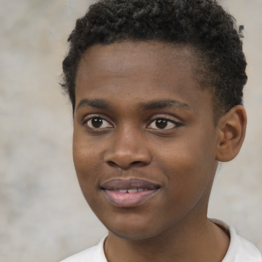 Joyful black young-adult male with short  brown hair and brown eyes