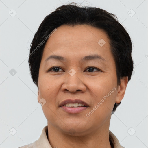 Joyful asian adult female with short  brown hair and brown eyes