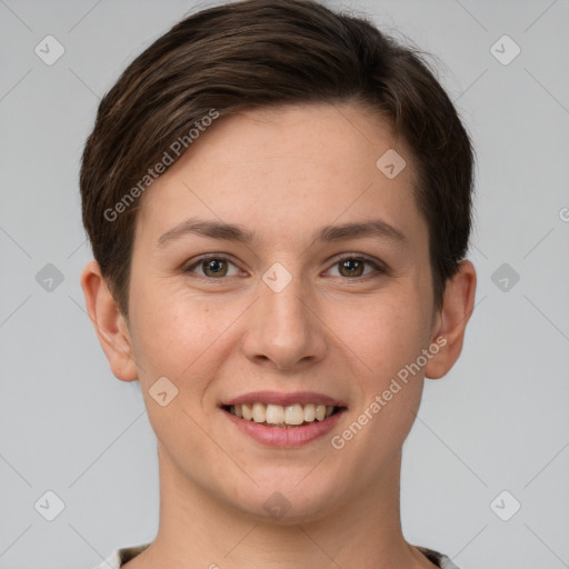 Joyful white young-adult female with short  brown hair and grey eyes