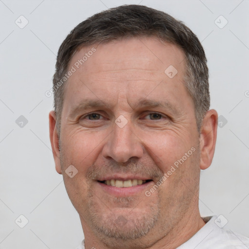 Joyful white middle-aged male with short  brown hair and brown eyes