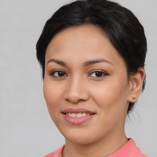 Joyful asian young-adult female with medium  brown hair and brown eyes