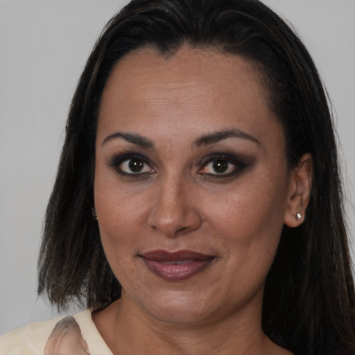 Joyful asian adult female with medium  brown hair and brown eyes