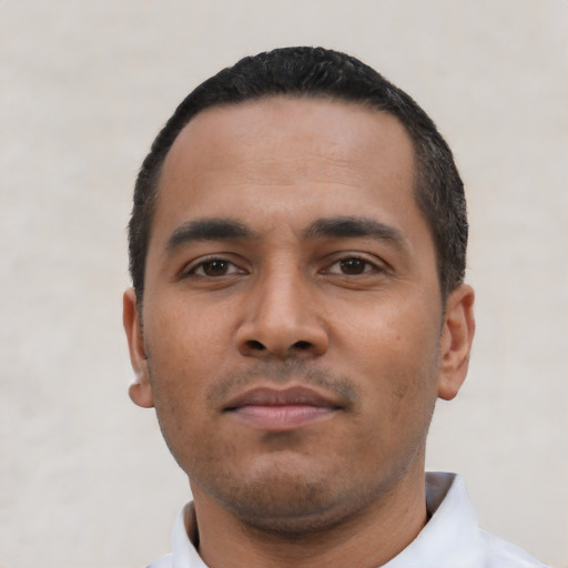 Neutral latino young-adult male with short  black hair and brown eyes