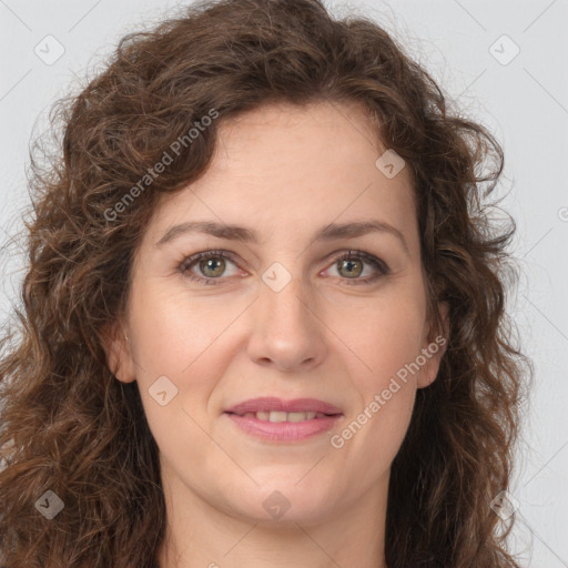 Joyful white young-adult female with long  brown hair and green eyes