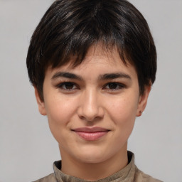 Joyful white young-adult female with short  brown hair and brown eyes