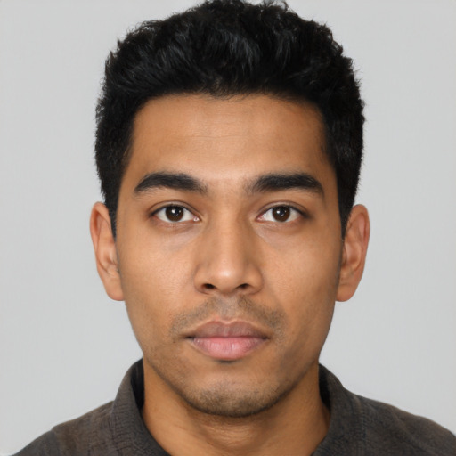 Neutral latino young-adult male with short  black hair and brown eyes