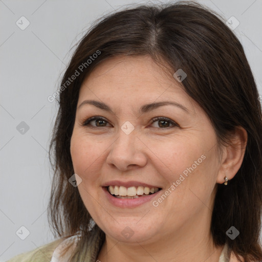 Joyful white adult female with medium  brown hair and brown eyes