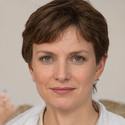 Joyful white adult female with short  brown hair and grey eyes