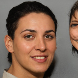 Joyful white adult female with short  brown hair and brown eyes