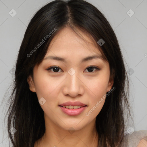 Joyful asian young-adult female with long  brown hair and brown eyes