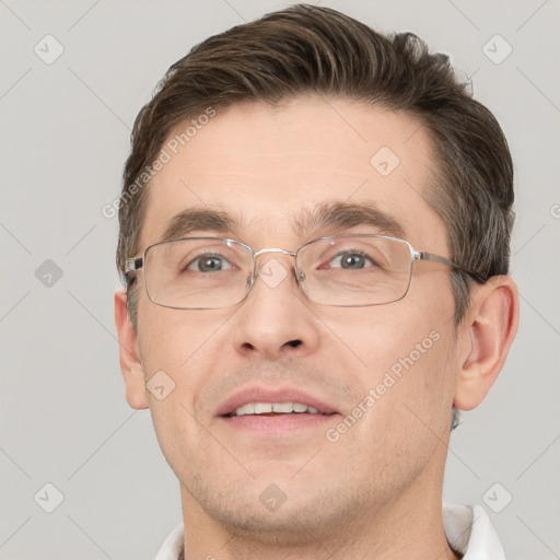 Joyful white adult male with short  brown hair and grey eyes