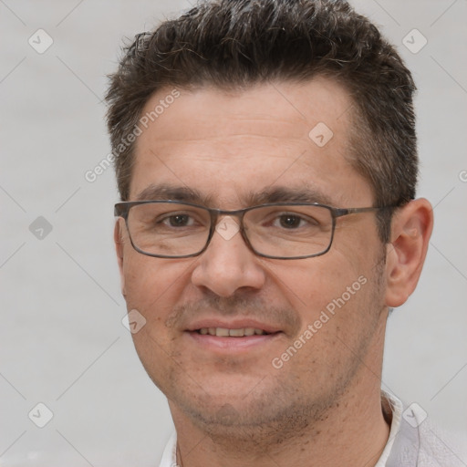 Joyful white adult male with short  brown hair and brown eyes