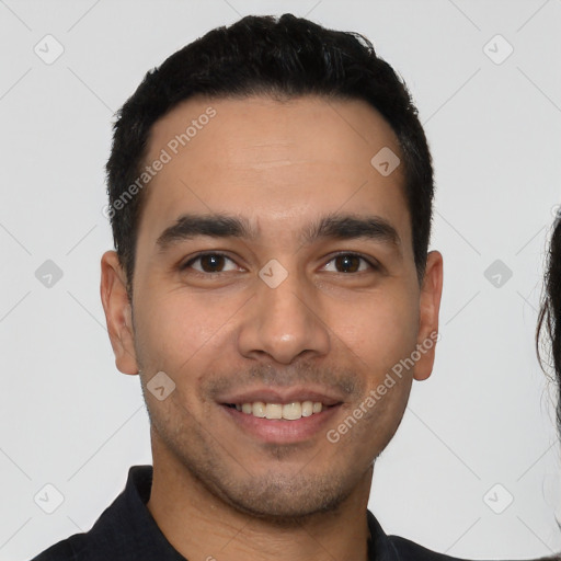 Joyful white young-adult male with short  black hair and brown eyes