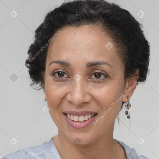 Joyful black adult female with short  brown hair and brown eyes