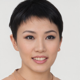 Joyful asian young-adult female with short  brown hair and brown eyes