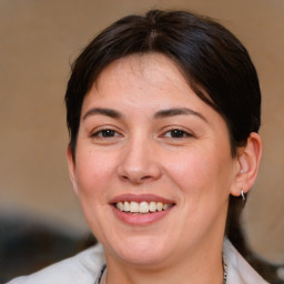 Joyful white adult female with medium  brown hair and brown eyes