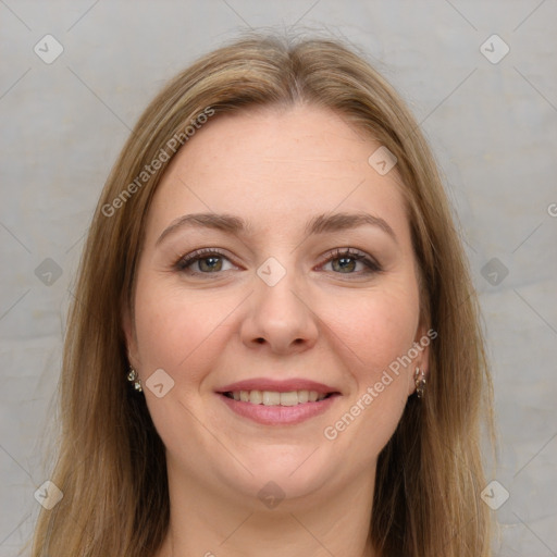 Joyful white young-adult female with long  brown hair and green eyes