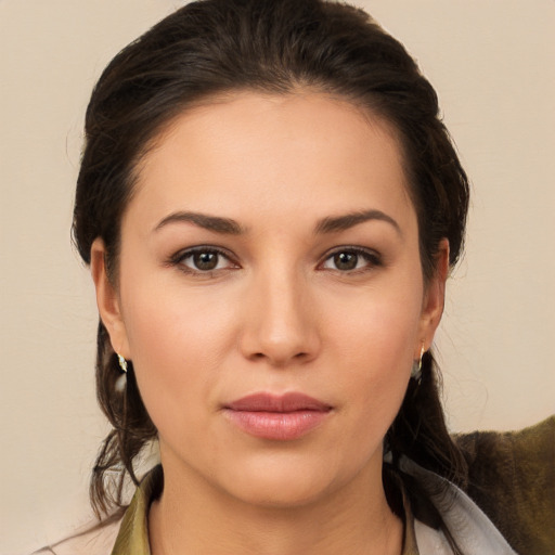 Joyful white young-adult female with medium  brown hair and brown eyes