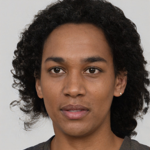 Neutral black young-adult female with medium  black hair and brown eyes