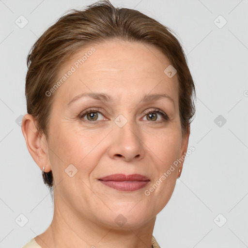 Joyful white adult female with short  brown hair and grey eyes