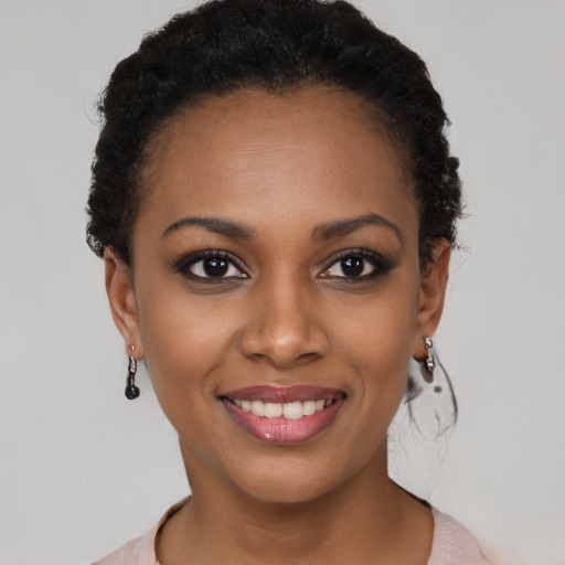 Joyful latino young-adult female with short  brown hair and brown eyes