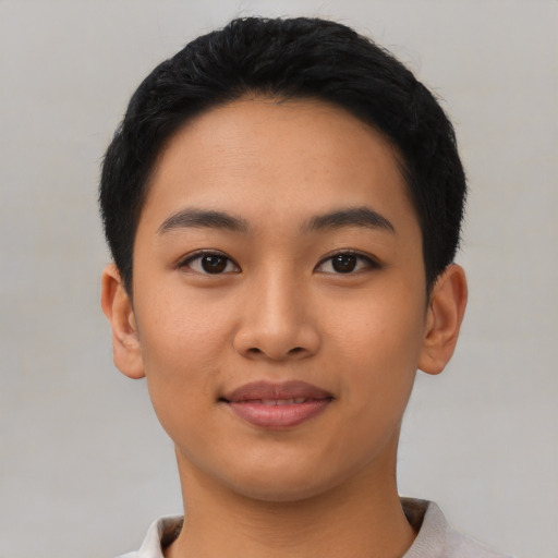 Joyful asian young-adult female with short  black hair and brown eyes