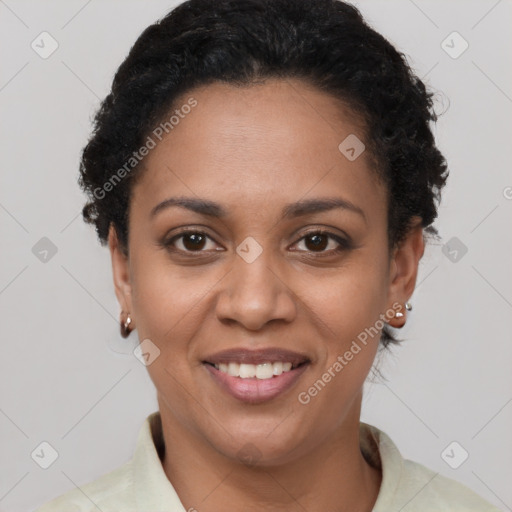 Joyful black young-adult female with short  brown hair and brown eyes