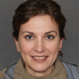 Joyful white adult female with short  brown hair and brown eyes