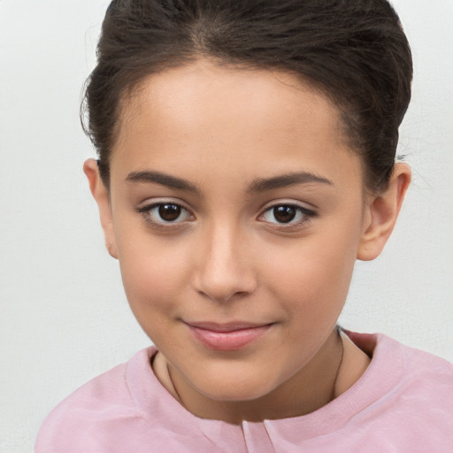 Joyful white child female with short  brown hair and brown eyes