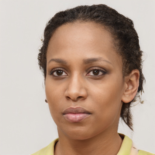 Neutral black young-adult female with short  brown hair and brown eyes