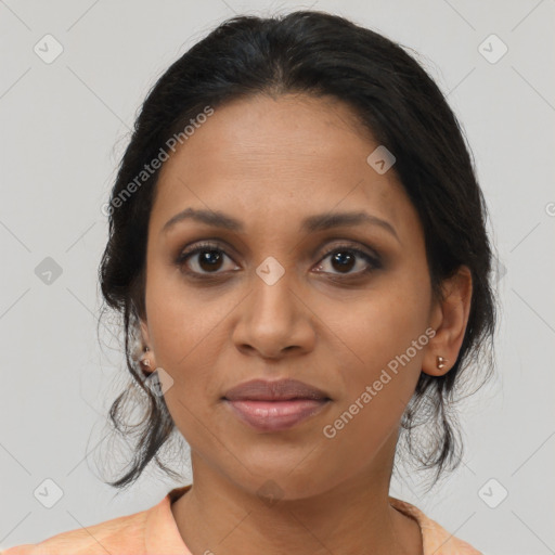 Joyful black young-adult female with medium  brown hair and brown eyes