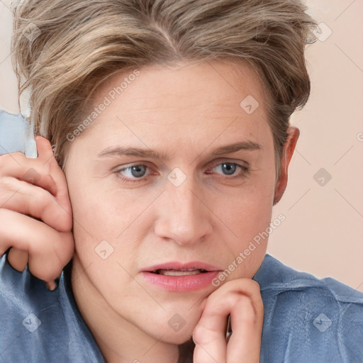 Joyful white young-adult female with short  brown hair and blue eyes