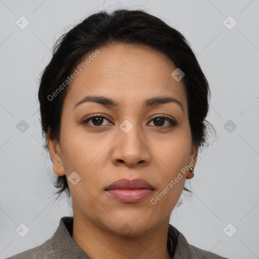 Joyful latino young-adult female with medium  brown hair and brown eyes