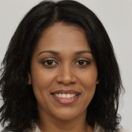 Joyful asian young-adult female with long  brown hair and brown eyes