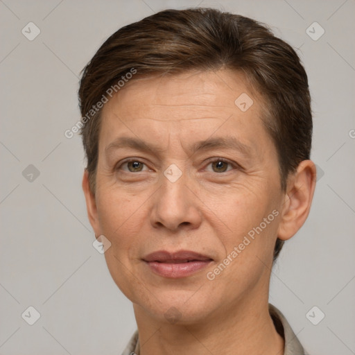 Joyful white adult female with short  brown hair and brown eyes