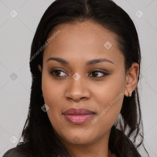 Joyful black young-adult female with long  brown hair and brown eyes