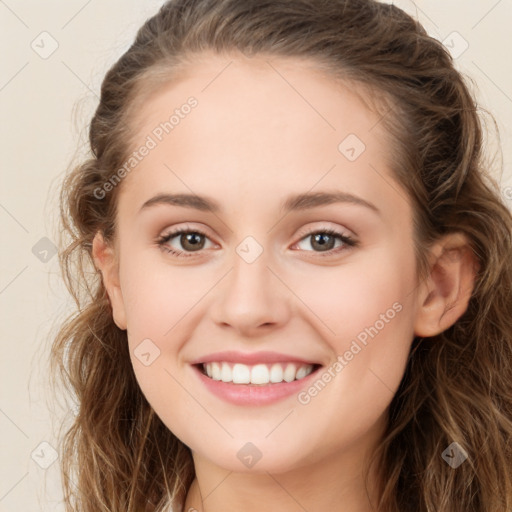 Joyful white young-adult female with long  brown hair and green eyes