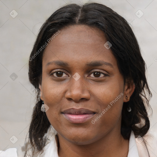 Joyful black young-adult female with medium  brown hair and brown eyes