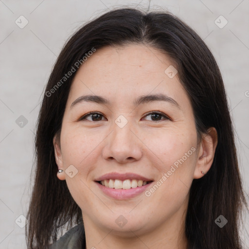 Joyful asian young-adult female with long  brown hair and brown eyes