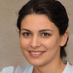 Joyful white young-adult female with medium  brown hair and brown eyes