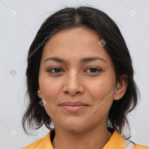 Joyful latino young-adult female with medium  brown hair and brown eyes