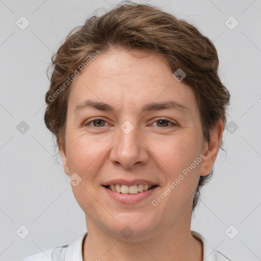 Joyful white adult female with medium  brown hair and brown eyes