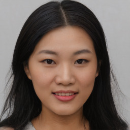 Joyful asian young-adult female with long  black hair and brown eyes