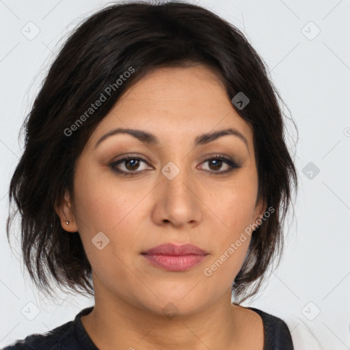 Joyful latino young-adult female with medium  brown hair and brown eyes