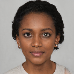 Neutral black young-adult female with short  black hair and brown eyes