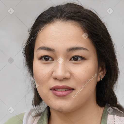 Joyful asian young-adult female with medium  brown hair and brown eyes