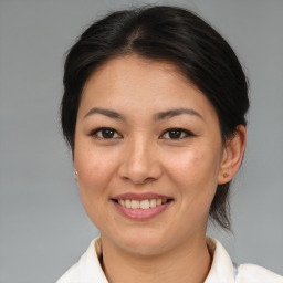 Joyful asian young-adult female with medium  brown hair and brown eyes