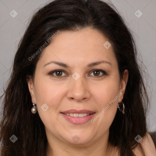 Joyful white adult female with long  brown hair and brown eyes